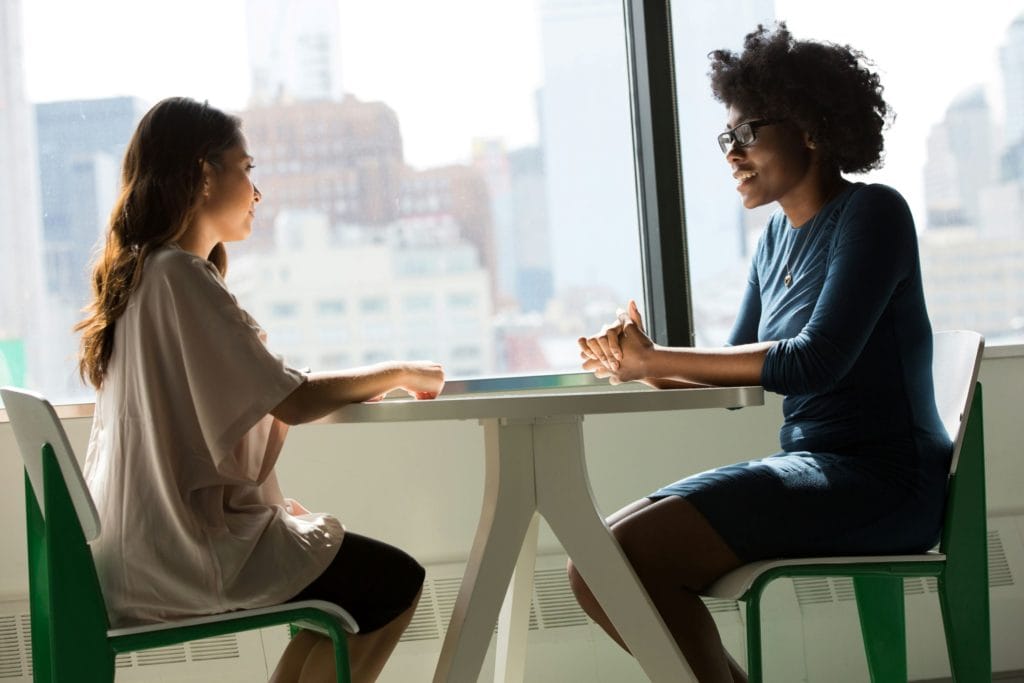 two professional women in conversation