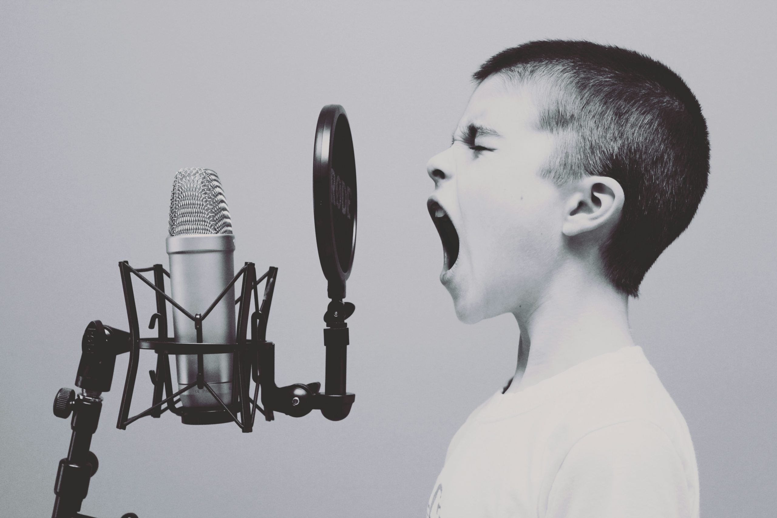 kid yelling into microphone