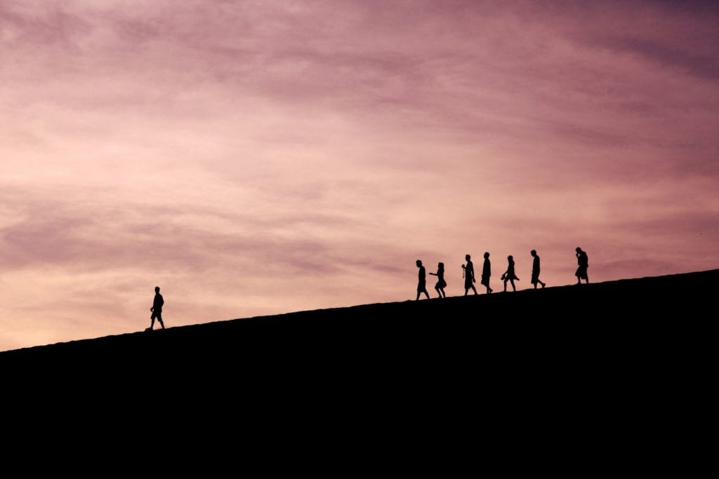 leading a group hike at dusk