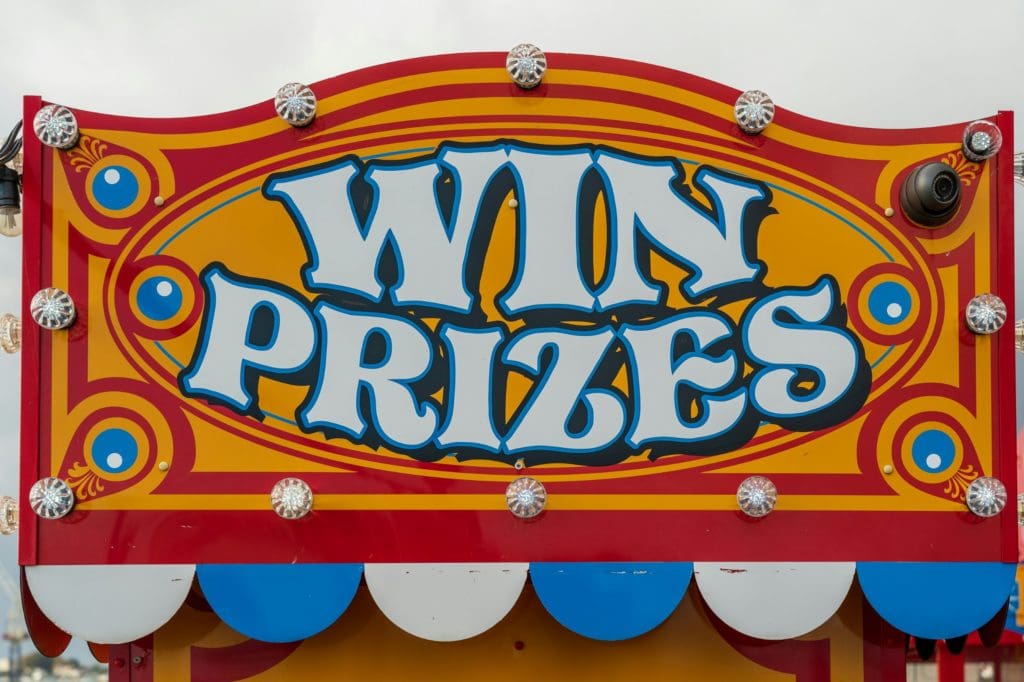 carnival sign that says "win prizes"