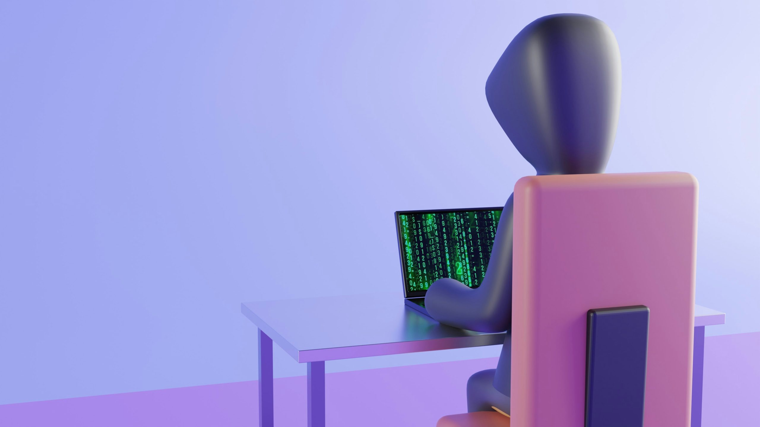 hooded figure sitting at computer