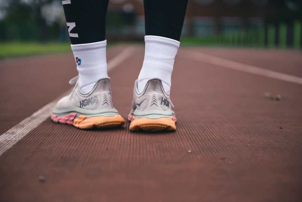 person in walking shoes on track